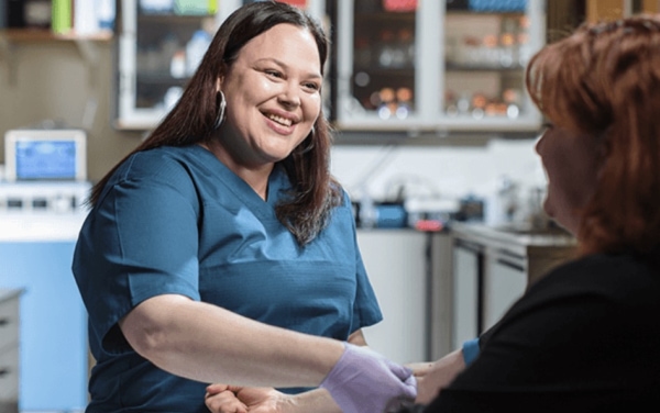 Woman giving needle